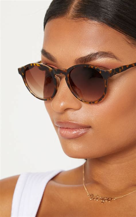 round tortoiseshell sunglasses.